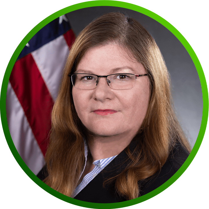 Headshot of Melissa Vice with the U.S. Flag in the background