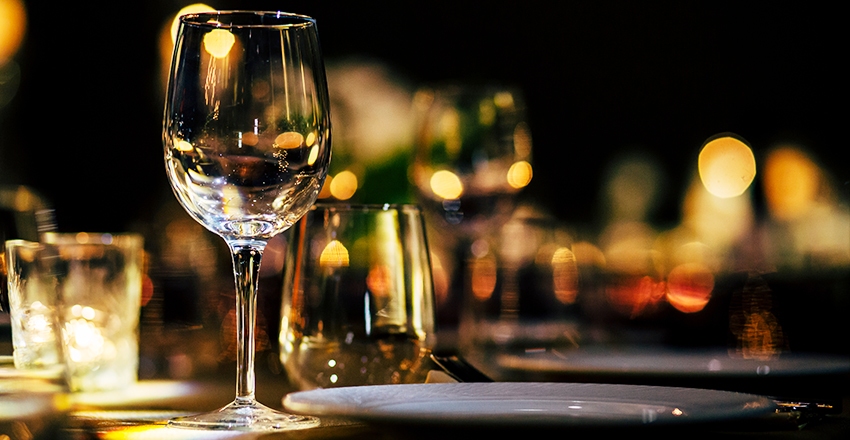 wine glasses on a candle-lit tablescape